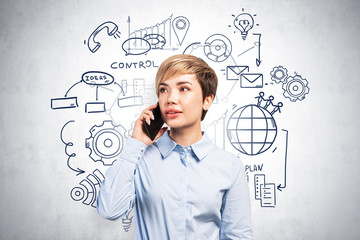 Woman on phone and business plan