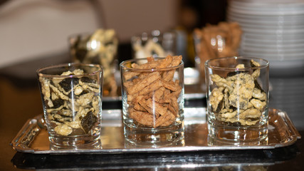 Front view of dry food with fish in many cups