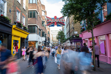 Carnaby Street In London UK With Motion Blurred Shoppers