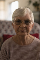 Senior woman looking at camera in nursing home