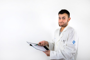 Young male doctor with beard pointing medical report isolated on white background