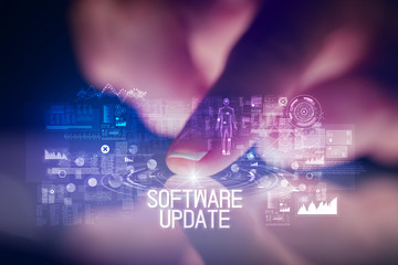Finger touching tablet with web technology icons and SOFTWARE UPDATE inscription