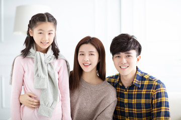 Happy asian family with daughter  at home