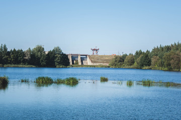 Fototapeta premium a small water dam near the lake.