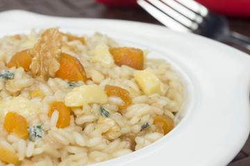 Gorgonzola cheese risotto with damascus and walnuts  close