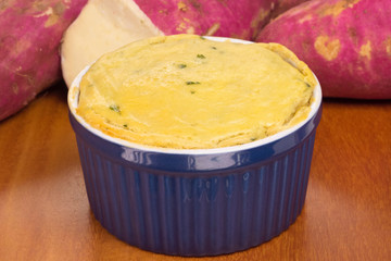 Diet version of shepherd's pie made of sweet potato in wood background