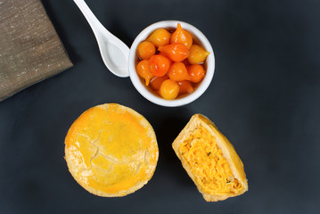 Traditional Brazilian mini chicken pies called empada with pepper pout in with one openslate background seen from above