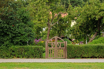 Wooden plank garden gate entrance to a garden