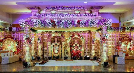 indian beautiful, stylish and royal wedding decoration stage with natural flowers