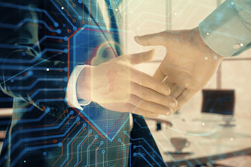 Double exposure of lock icon hologram on office background with two men handshake. Concept of data safety