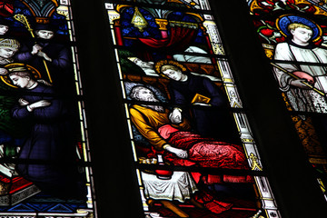 Fototapeta na wymiar religion stained glass window religious scene red yellow green