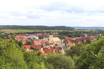 Fototapeta na wymiar panoramic view with a Bavarian village in green surrounding
