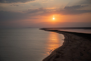 Obraz premium Black Sea and Kayashsky salt lake in the Opuksky reserve in the evening at sunset, Crimea