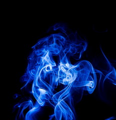 Blue smoke on black background
