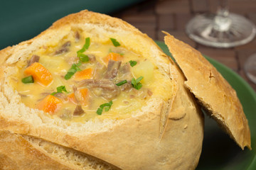 Meat and vegetable soup served in Pagnotta Italian bread