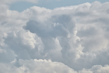 Naklejka na ściany i meble Beautiful cumulus clouds a summer day
