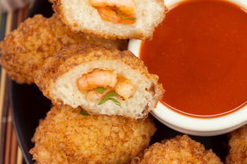 Tapioca fried balls stuffed with shrimp and pepper sauce seen from above