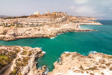 Fototapeta na wymiar Melilla, a Spanish province bordering with Morocco in Africa. View of the city walls on the rocky coast of the Mediterranean Sea.