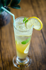 Mojito cocktail with lime and mint in high glass.