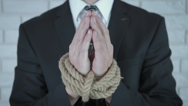 Man`s hand with ropes.