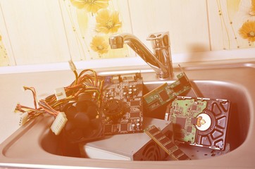 Hardware in kitchen sink computer cleaning metaphoric concept