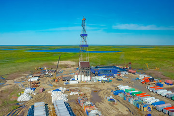 Drilling rig and equipment at an oil field in the northern tundra. Top view from a helicopter....