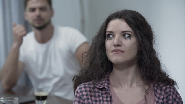 Guy swearing and screaming to his curly girlfriend in the living room she is criyng becouse of bed emotions