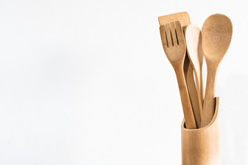 isolated wooden kitchen utensils