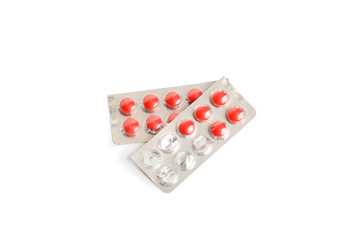 Medicine pills in blister, drug tablets isolated on white background. Pharmacy and medication.