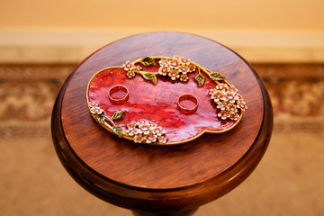 Gold wedding rings on stand for rings