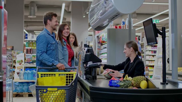 People buying goods in a grocery store
