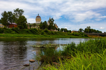 Fototapeta na wymiar Scenic view of the river and the church in the town of Torzhok (Russia)