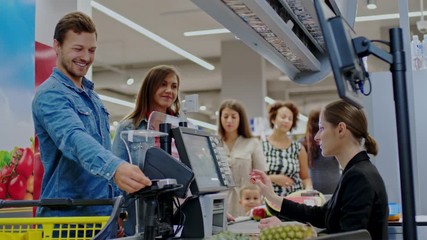 People buying goods in a grocery store