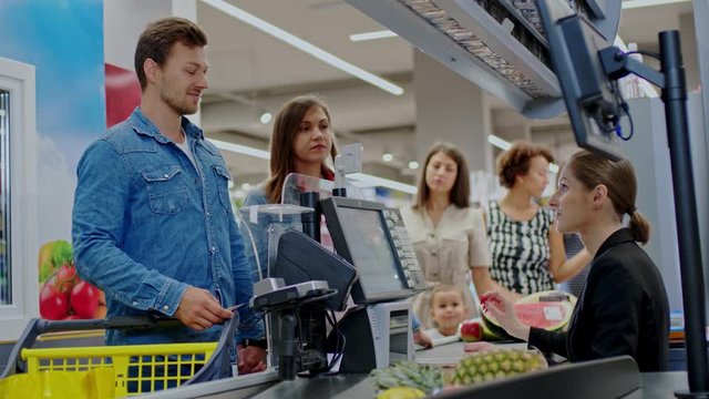 People buying goods in a grocery store