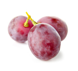 Ripe sweet grapes on white background