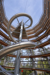 Bad Wildbad, Germany - April 22, 2019: Baumwipfelpfad Treetop walk tower with slide in Schwarzwald Forest. High tower for walking tourists in the Schwarzwald forest, a tourist attraction in Germany