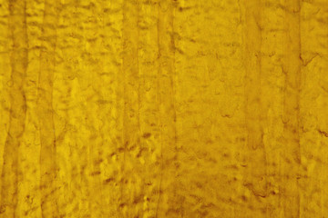 Texture of golden cement wall.