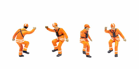 Group of Miniature figurine character as railway shunter standing and posing in posture isolated on white background.