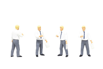 Miniature figurine character as teacher standing and posing in posture isolated on white background.