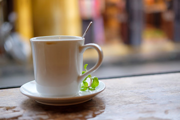 cup of coffee on wooden table