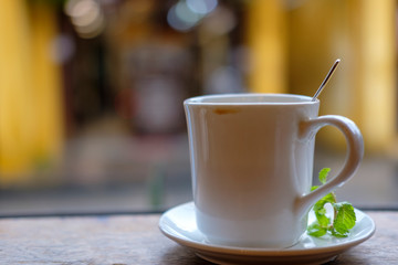 cup of coffee on wooden table