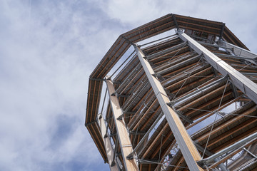 Bad Wildbad, Germany - April 22, 2019: Baumwipfelpfad Treetop walk tower with slide in Schwarzwald Forest, near Bad Wildbad. High tower for walking tourists in the Schwarzwald forest,