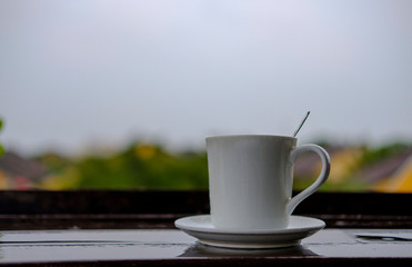 cup of coffee on wooden table