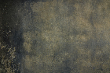 artistic dark gray background old flat porous shabby scratched concrete plaster on an ancient wall in the gloom for a creative design project
