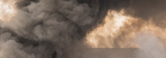 burning buildings and a warehouse, smoke and fire in the city