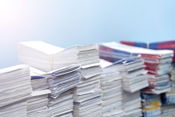 Stacks of paper files work desk office, business report papers, piles of unfinished documents, Business concept.
