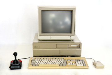 Classic Retro PC from the Eighties with Monitor, Mouse and Joystick. Used for Gaming, Writing and Graphics on White