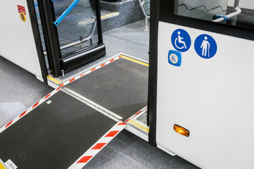 platform for wheelchairs, prams, elderly people in the cabin of a modern and comfortable city bus...