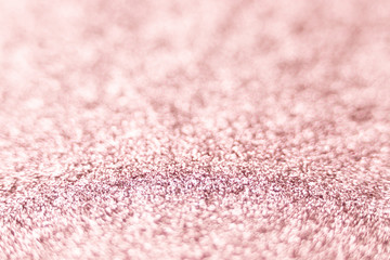 Pink glitter texture Festive sparkling sequins background closeup. Wpaper for Valentine, New Year or Christmas Holidays.