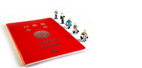 Japanese passport and Small figure people. Travel to the country..